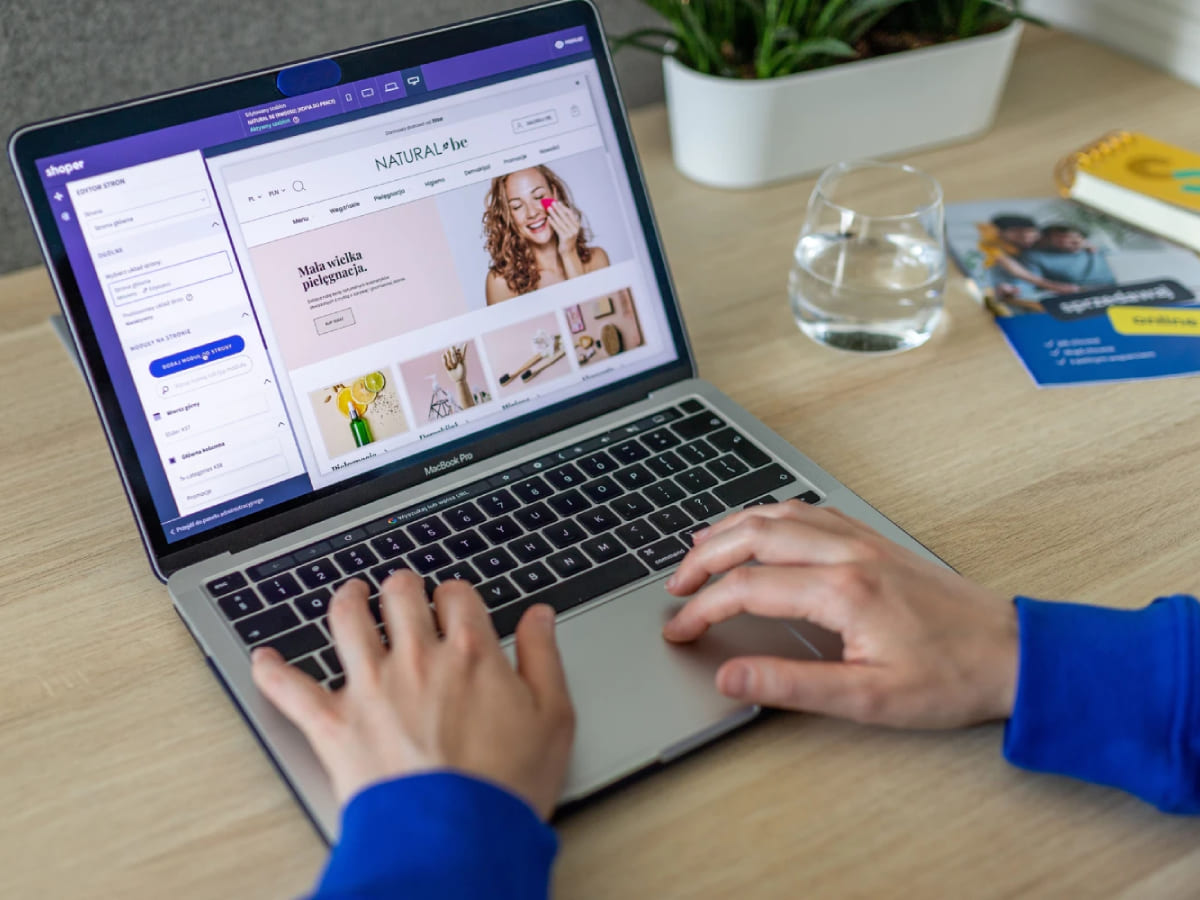 Designer creating an e-commerce experience on a laptop